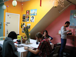 guests enjoying the communal kitchen table